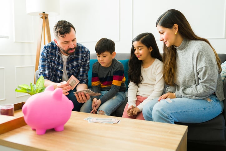Family talking giving their kids allowance money