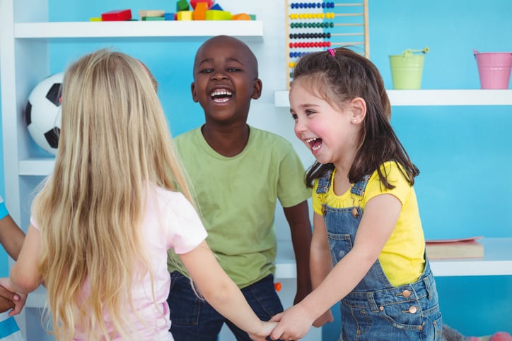 Happy kids holding hands together - what is a microschool