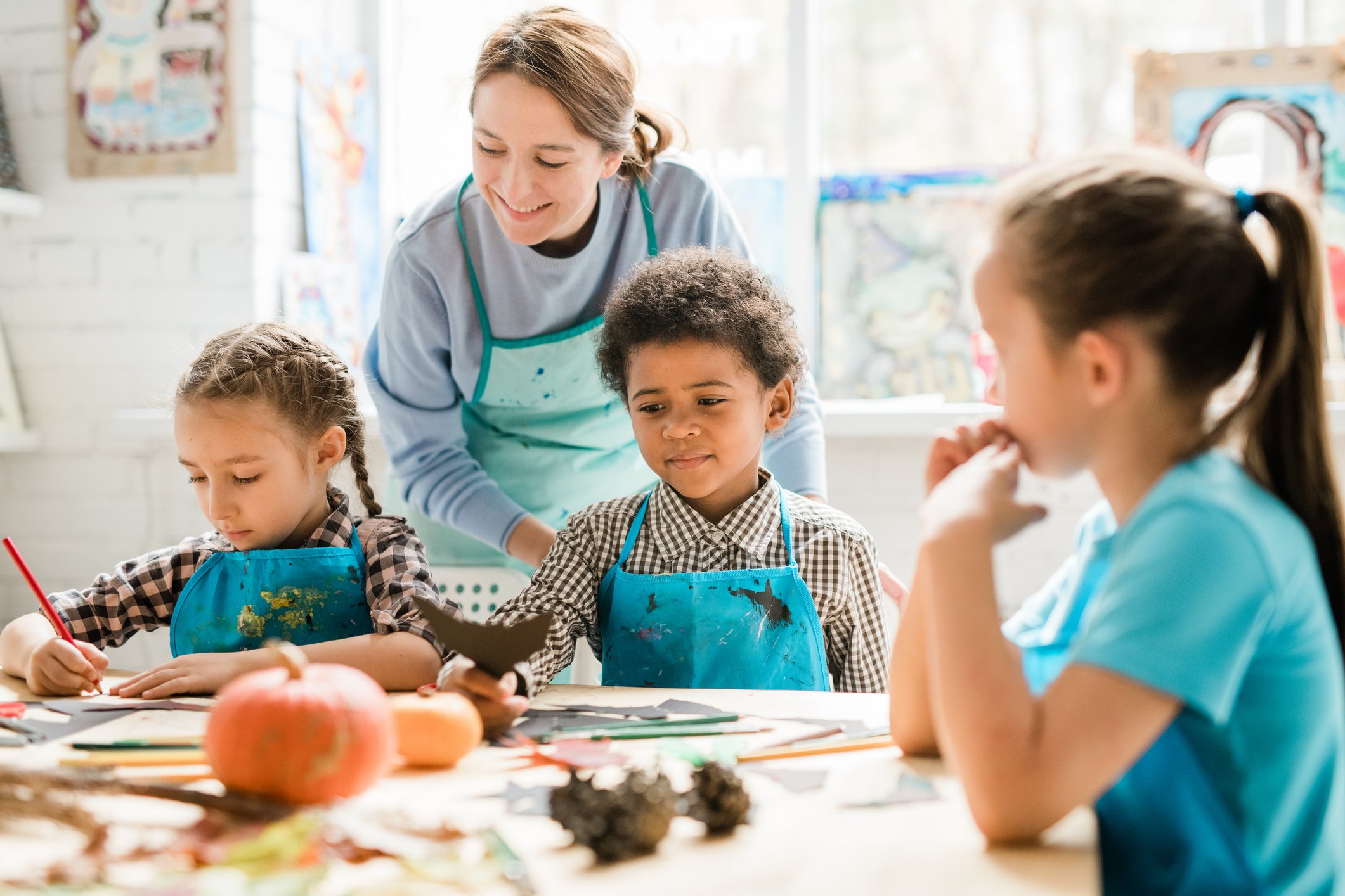 Preschool Classroom Fall Craft with Teacher Guidance