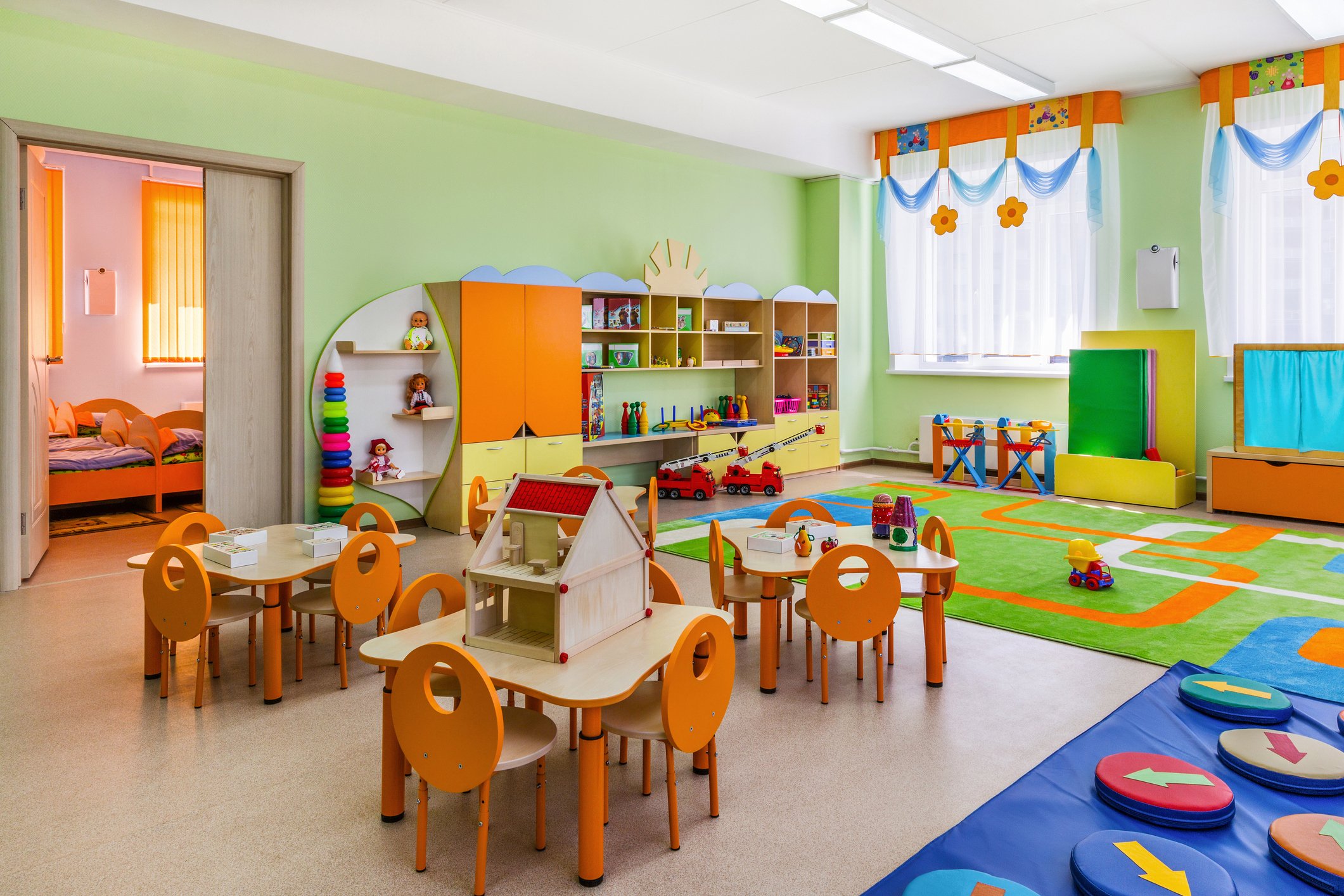 Organized daycare classroom with labeled learning area