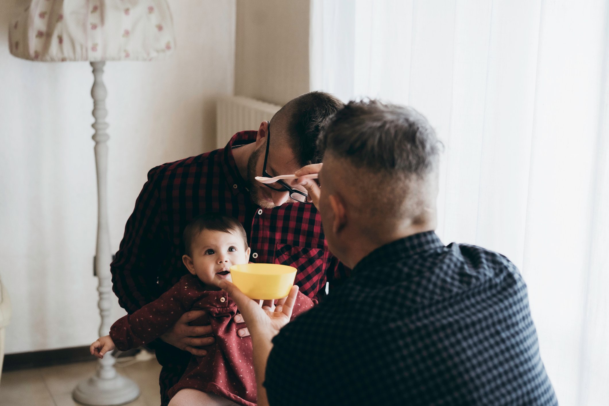 dads feeding toddler child