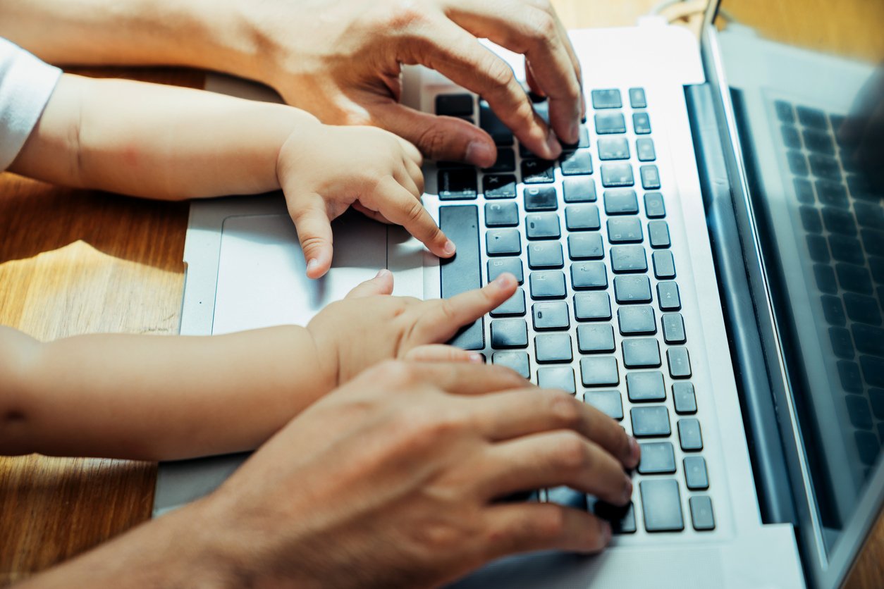 Parent and child using computer