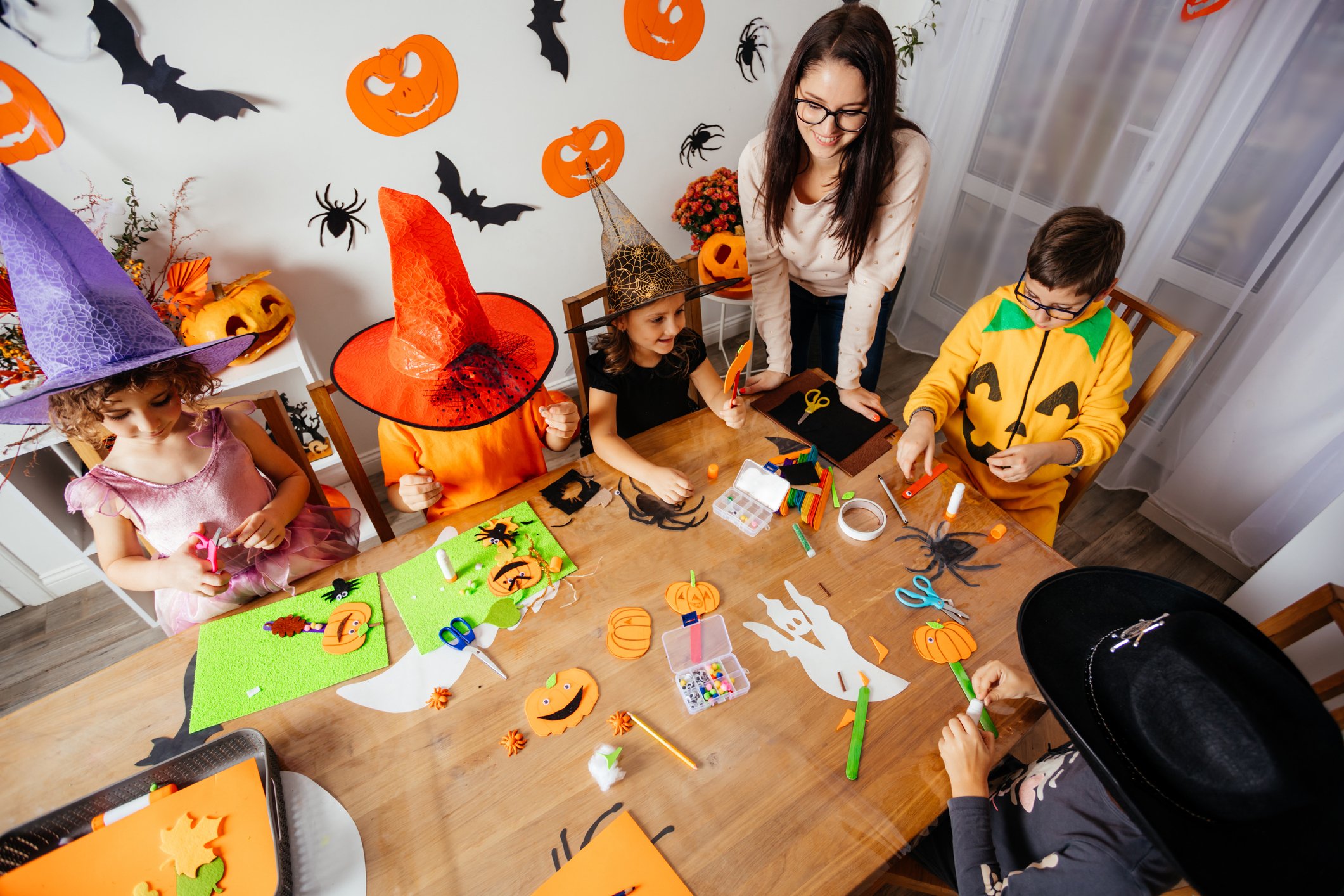 Children enjoying inclusive Halloween at daycare activities in a classroom setting.