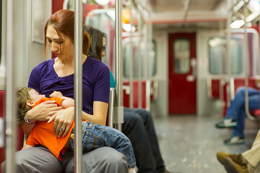 woman nursing child