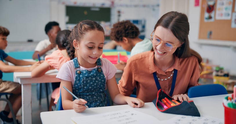 teacher in classroom, help and support with literacy knowledge