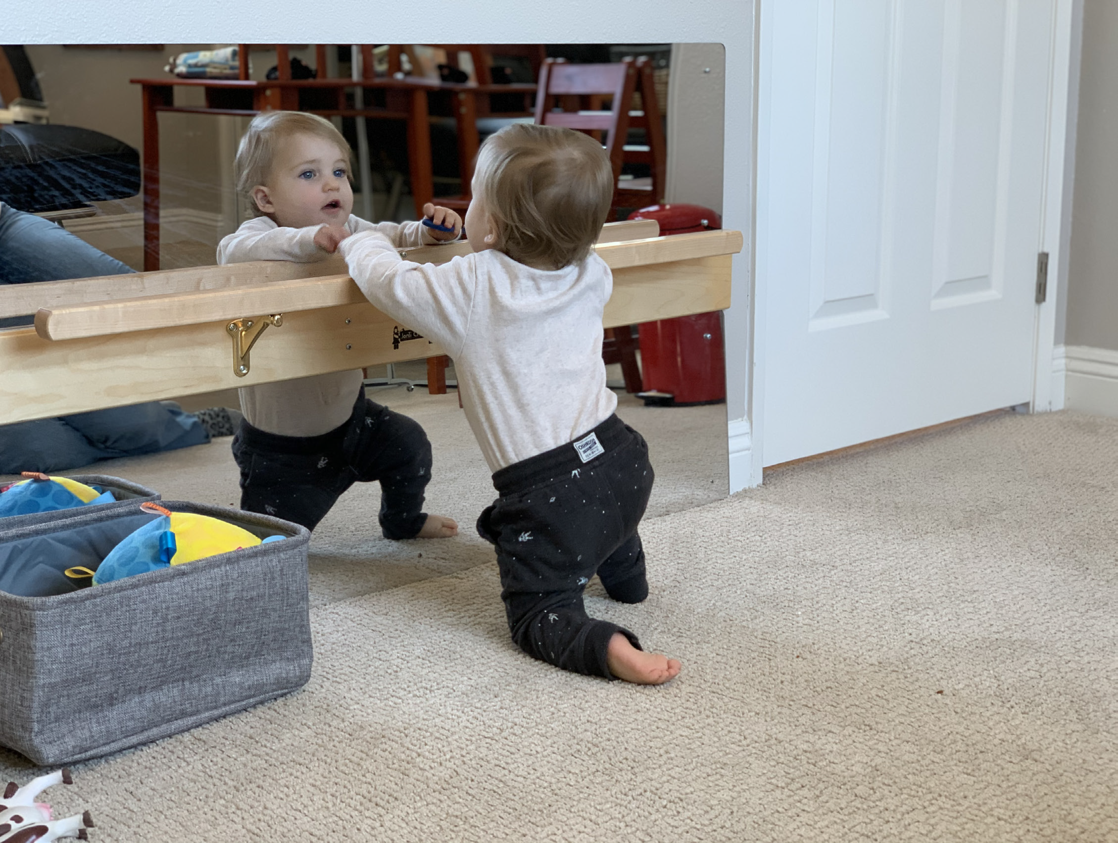 child looking in mirror